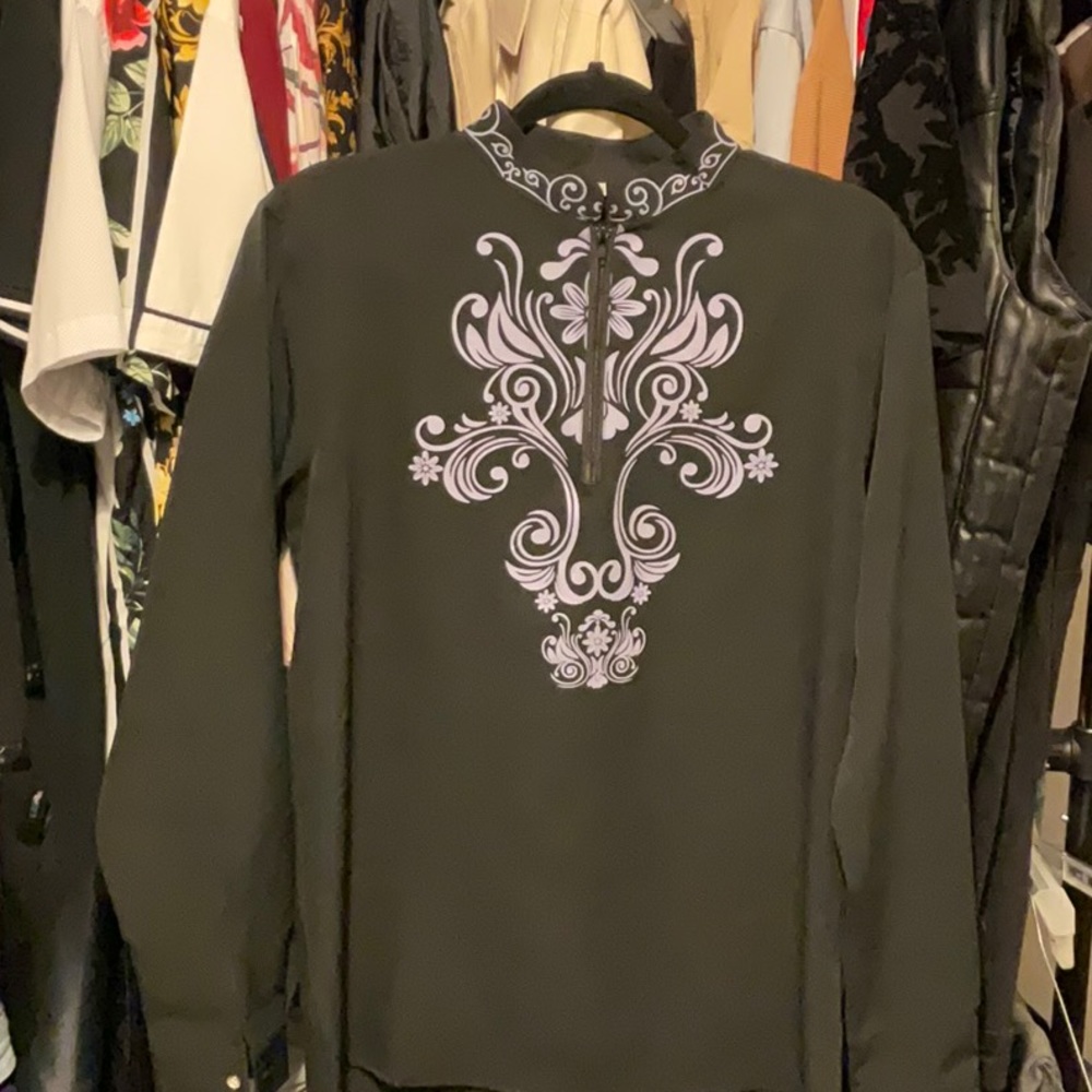 A party shirt that was worn one time to a black and white event, super light.